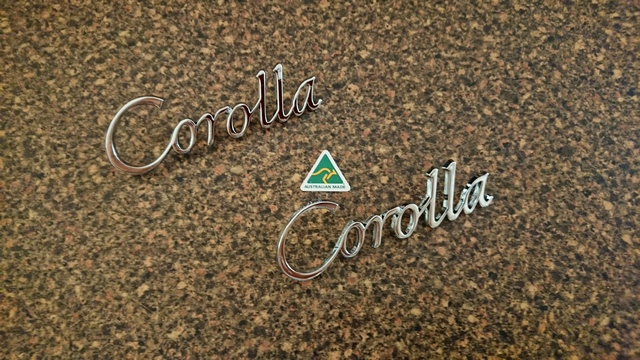 Toyota Corolla E10 Series script mud-guard (fender) badge